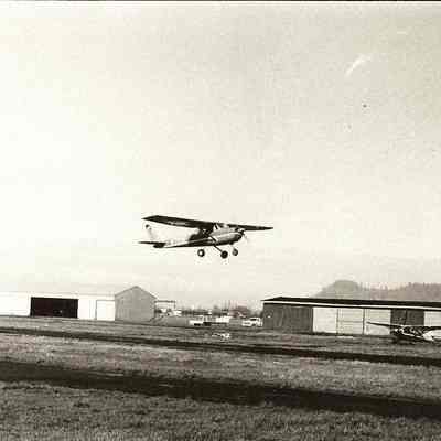 Photograph of a Small Propeller Plain Taking Off at McKenzie Airport, Circa 1970