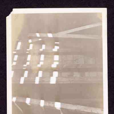 Photograph of ladder, wall and window, close up, location and date unknown
