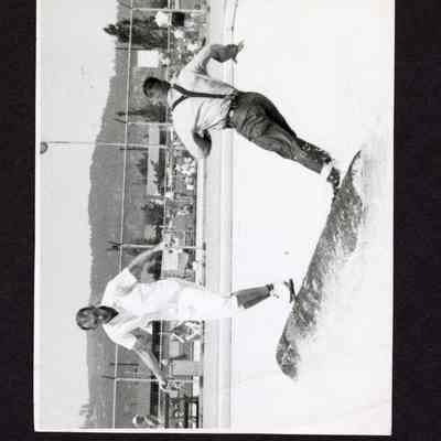 Photograph, Men Log Rolling in Pool, Date Unknown.