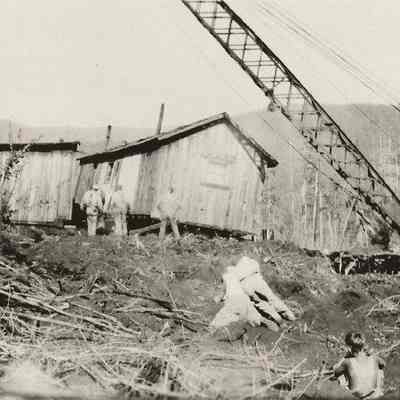 Photograph of a building being moved onto a clearing inn the woods, above Wendling, Oregon