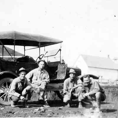Photograph of Four Men and a Car