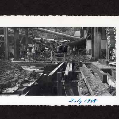 Photograph of a truck full of beam poles, June 26, 1948"