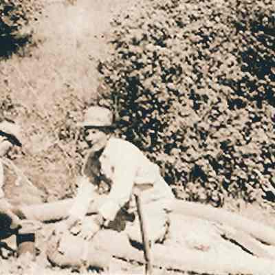 Photograph of Ernie Berg and Worker hooking up pipes, undated