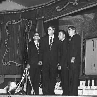Photograph of quartet singing at barbershop parade, 1954