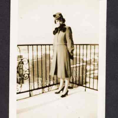 Photograph of woman on a balcony, undated