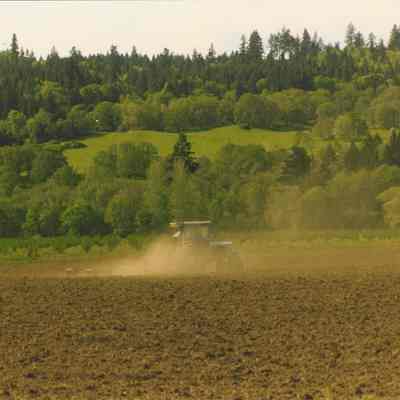 Photograph of Tractor Plowing Field at Seavey Farm, 1996