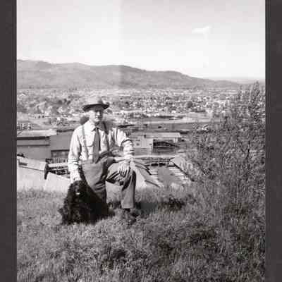 Photograph of Man with Dog on Willamette Heights near Booth-Kelly Mill, 1940s