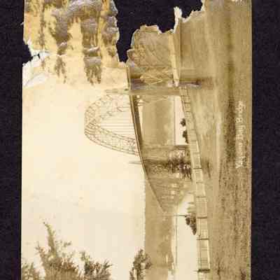 Photograph of Yaquina Bay Bridge. Photo is torn along the left side. Date unknown.
