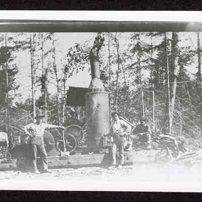 Photograph of a Steam Donkey and its crew. Date unknown.
