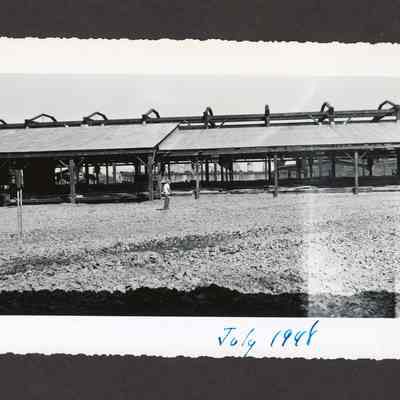 Photograph of the filling of the old log pond at Booth-Kelly Lumber Mill