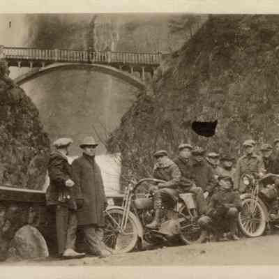 Photograph of motorcyclists in front of Multnomah Falls, circa 1920-1925