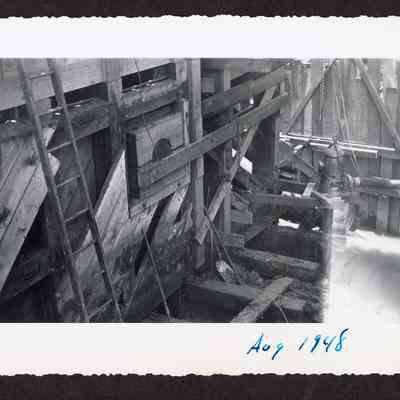 Photograph of the consturction of a new dam at Booth-Kelly Lumber Mill