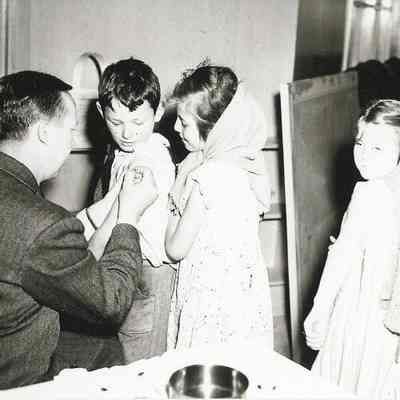Photograph of elementary school students receiving vaccinations at Springfield High School, Springfield, Oregon, circa 1940s