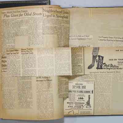 Pages 22-23 loose newspaper clipping unfolded