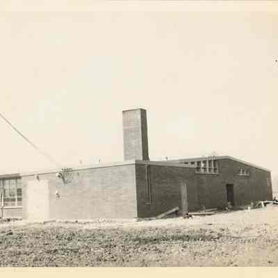 Photograph of a school building, 1940s