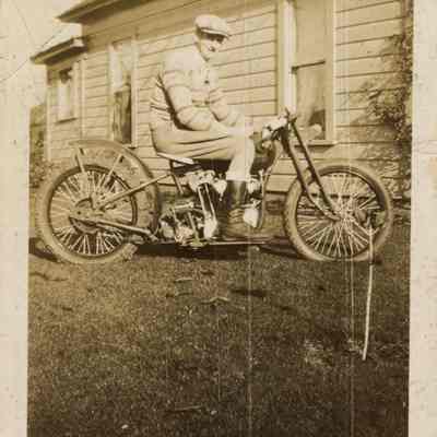 Photograph of Bill Davis senior and his motorcycle, circa 1920-25