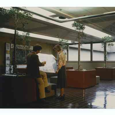 Photograph of people looking at an architectural drawing at Springfield City Hall, circa 1981