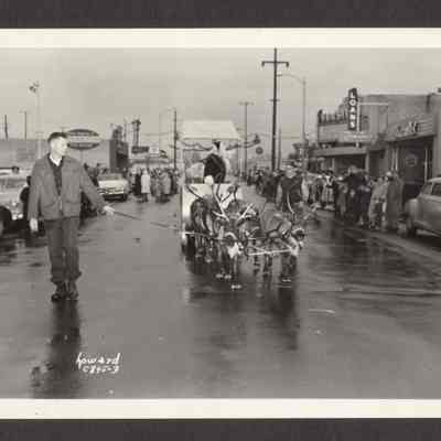 Photograph of Springfield, Oregon Christmas Parade. Santa in his Sleigh with his reindeer. December 10, 1955.