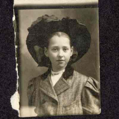 Photograph of unknown young woman wearing hat