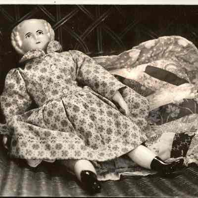 Photograph of old Doll and Pillow on Chair, Undated