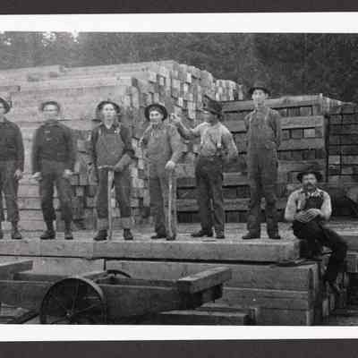 Photograph of eight unknown men in the Southern Pacific tie yard, Marcola, Oregon, circa 1907-1908