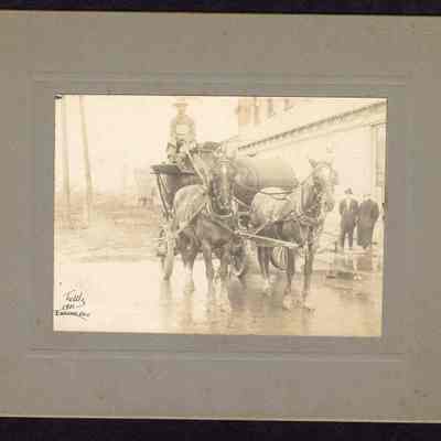 Photograph, Water wagon street sprinkler, 3rd and Main looking North, Springfield Oregon, Date unknown.