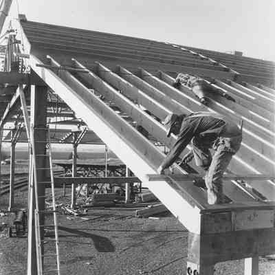 Photograph of carpenters framing a new mill