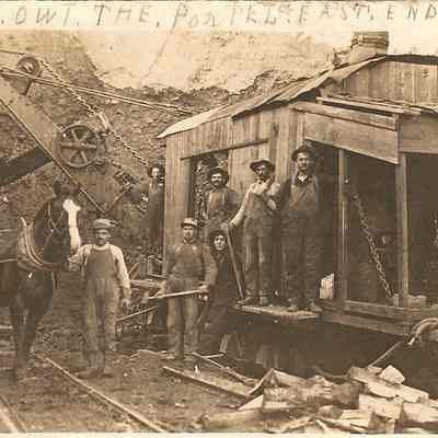 Photograph postcard of eight unknown men with horse and machinery at train tracks, Eula, Oregon, circa 1916