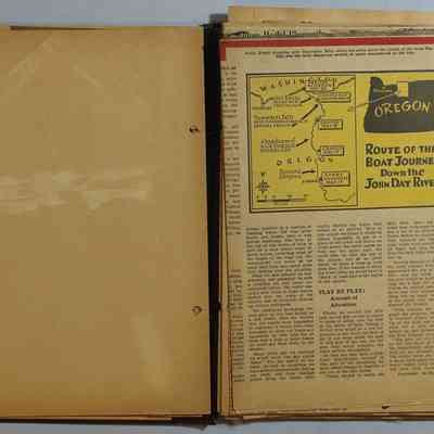 Loose newspaper clippings at back of scrapbook