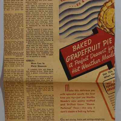 Loose newspaper clippings at back of scrapbook