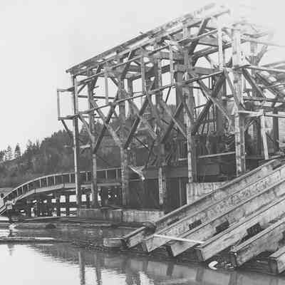 Photograph of Booth Kelly "Skid" into Millpond, 1956