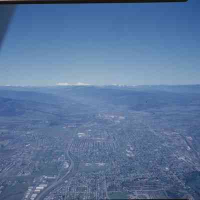 2021-005-1027_img-081: Springfield Aerial Photograph, Springfield Aerial Photograph, East to West (Sisters) (flipped, McKenzie should be on the left), 2021.005.1027, Envelope 10