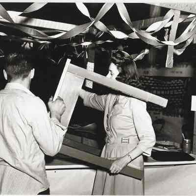 Photograph of two students preparing for a Springfield High carnival, Springfield, Oregon, circa 1940s