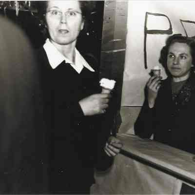 Photograph of two women eating ice cream at the Springfield High Carnival, circa 1940s