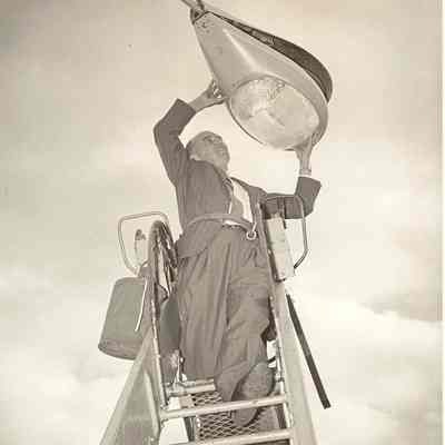 B. J. Rogers changing light bulb.