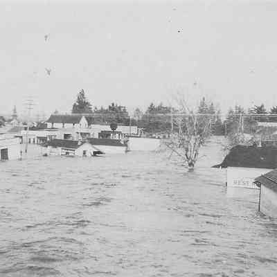 Photograph on postcard of flood wrecking houses, date unknown