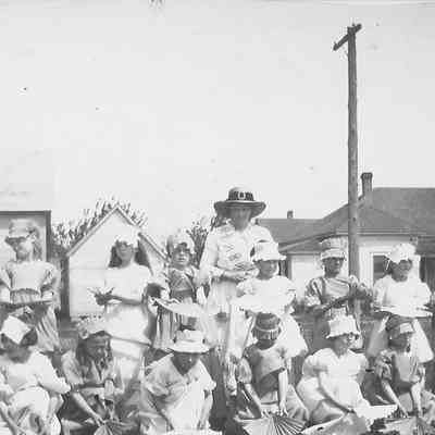 Photograph of girls holding fans, May Day at Lincoln School #8. 1921.