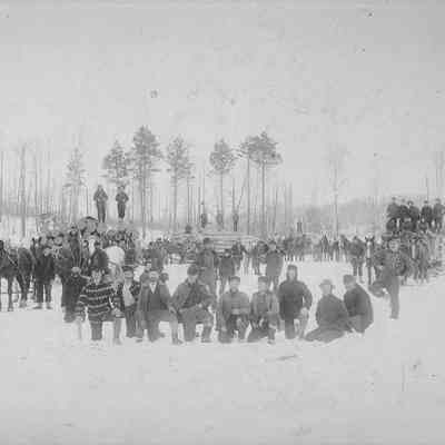 Photograph of logging crew in the snow, date unknown