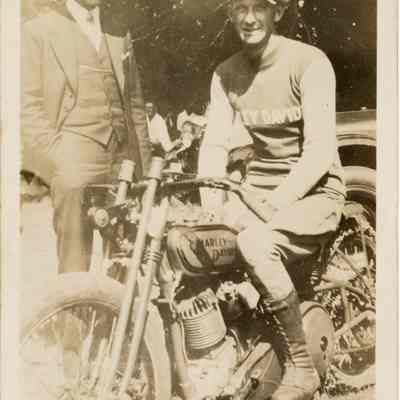 Photograph of Bill Davis senior on his motorcycle and a Harley-Davidson factory man, circa 1930