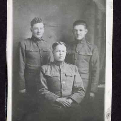 Photograph of three young men in military uniforms