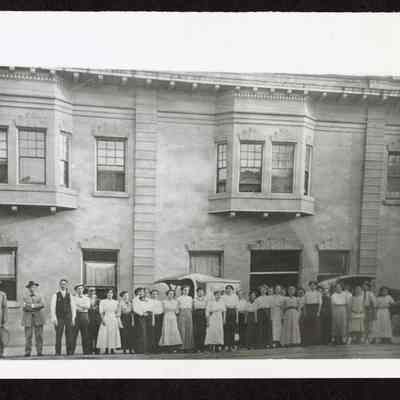 Photograph of large group of people outside Eugene Laundry, Eugene, Oregon