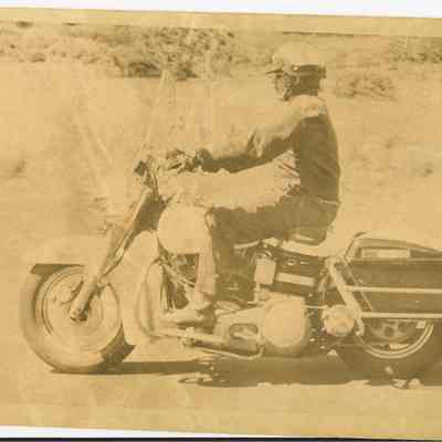 Photograph of Police Officer on Motorcycle