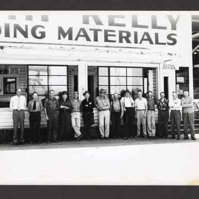 Photograph of workers outside of Booth Kelly Building Materials, undated