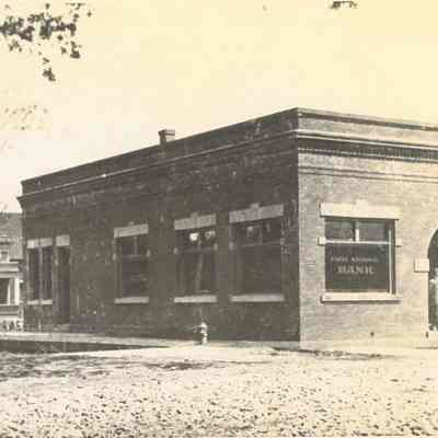 Photograph of a brick one story building, First National Bank, date unknown.
