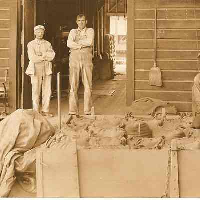 Photograph postcard of three men