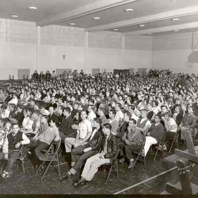 Photograph of high school assembly in gymnasium, date unknown.