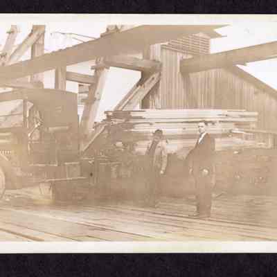 Photograph on postcard of loaded lumber truck at Jones Lumber Company, Portland, Oregon, date unknown
