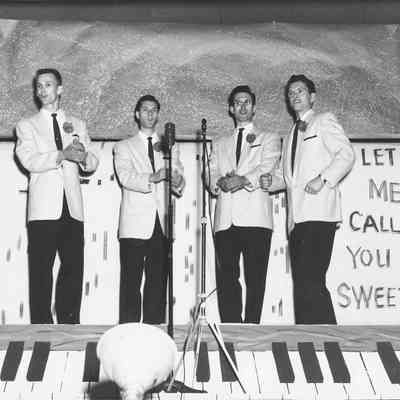 Photograph of quartet at barbershop parade, 1954