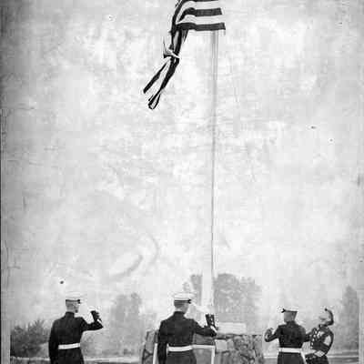Marines Raising a Flag at a Memorial