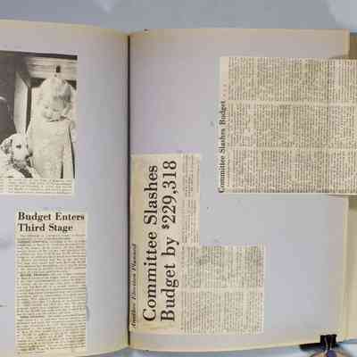 Page 115 newspaper clippings unfolded